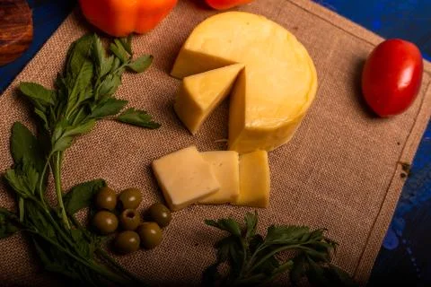 Cheese with serrano ham, olives on a table for a party with friends or as an  Stock Photos