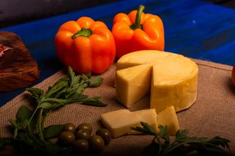 Cheese with serrano ham, olives on a table for a party with friends or as an  Stock Photos