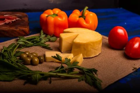 Cheese with serrano ham, olives on a table for a party with friends or as an  Stock Photos