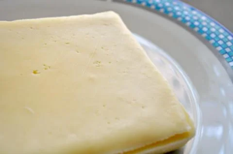 Cheese in sheets Stock Photos