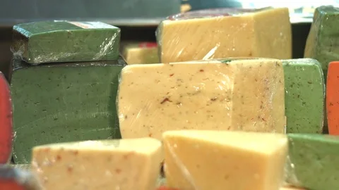 Cheese on the shelf in the supermarket. Видео 84178596