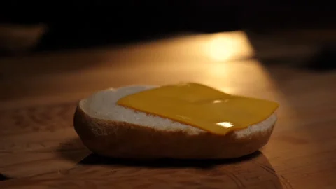 Cheese on a slice of bread 100fps Stock Footage 229933415