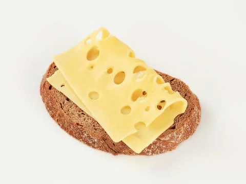 Cheese slice on dark bread close-up Stock Photos