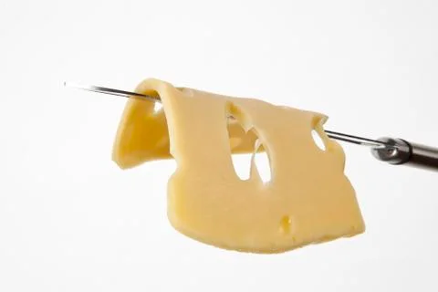 Cheese slice on knife. Stock Photos