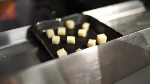 Cheese slices lying on a tray Stock Footage 71486179