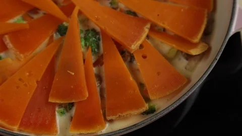 Cheese slices on a pan. Stock Footage 118020087