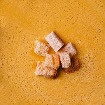 Cheese soup with crackers top view Stock Photos