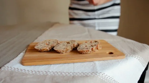Cheese is spread on bread. White cheese is spread over fresh bread. Stock Footage 105884749
