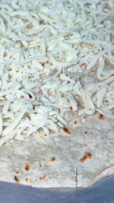 Cheese Spread Evenly on Tortilla Stock Footage 318749293