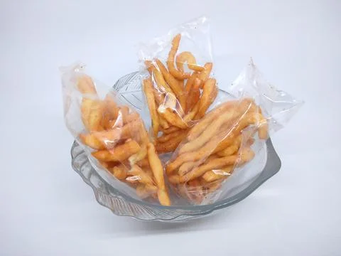 Cheese stick snack in a small plastic bag Stock Photos