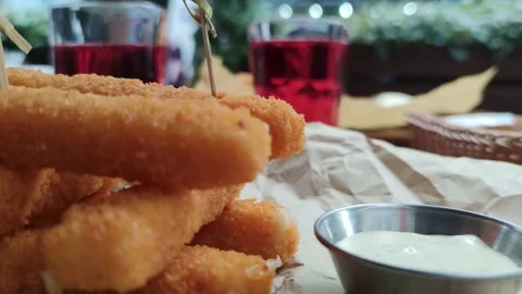 Cheese sticks and drinks on the background of a street cafe. Lunch out Stock Footage 252996730