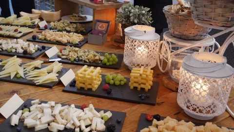 Cheese table in reception of a party Stock Footage 108374431