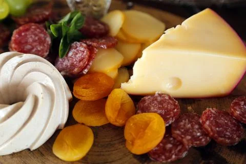 Cheese on table with snacks - party buffet with various savory foods Stock Photos