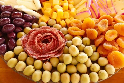 Cheese on table with snacks - party buffet with various savory foods Stock Photos
