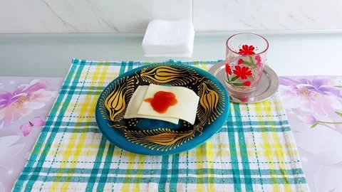 Cheese Tomato Elegance: A Cozy Snack in Vibrant Hues Stock Footage 312444536