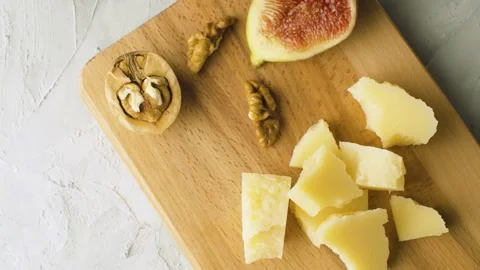 Cheese, walnuts and half fig Stock Footage 140028540