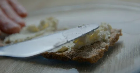 Cheese on wasa slowmotion‚ orginal file: 4K DCI, PRO RES 444, 12 bits Stock Footage 81698334