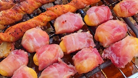 Cheese Wrapped in Bacon Grilling on BBQ Barbecue Grill Close Up 库存影片 344702933