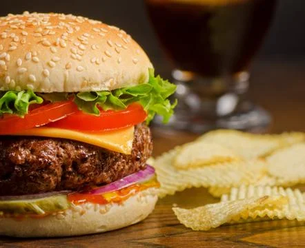 Cheeseburger and chips Stock Photos