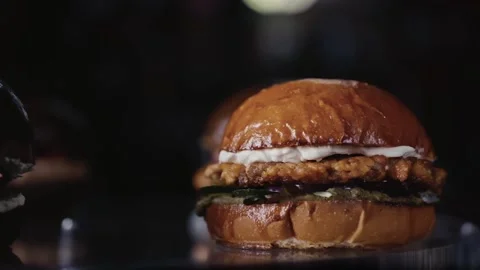 Cheeseburger and hamburger on black background. Stock Footage 159369242