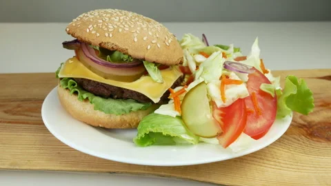 Cheeseburger and salad Stock Footage 241808804