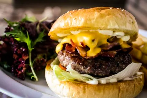 Cheeseburger with bacon Stock Photos