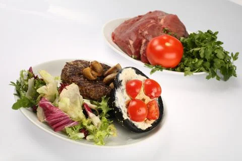 Cheeseburger with black bread, beef cutlet, bacon, tomatoes and cheese slices Stock Photos