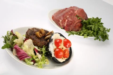 Cheeseburger with black bread, beef cutlet, bacon, tomatoes and cheese slices Stock Photos