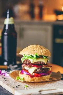 Cheeseburger with Bottle of Beer Stock Photos