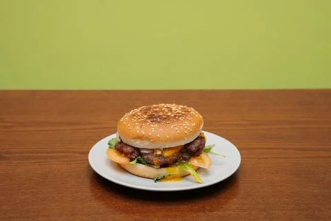 Cheeseburger front view on green Stock Photos