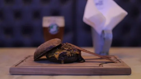 Cheeseburger made with Australian Bread, Cheddar Cheese and Caramelized Onion Stock Footage 129031961