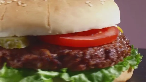Cheeseburger turns  close up Stock Footage 81489386