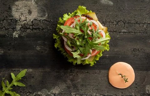 Cheeseburger on a wooden surface Stock Photos