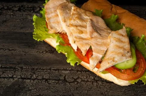 Cheeseburger on a wooden surface Stock Photos