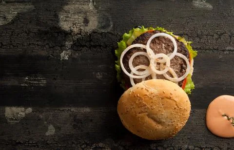 Cheeseburger on a wooden surface Stock Photos