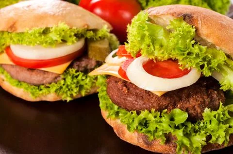 Cheeseburgers on table Stock Photos