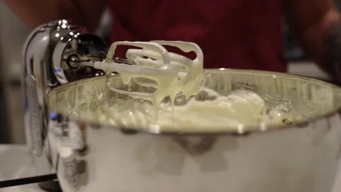 Cheesecake batter drips from beaters Stock Footage 222166094