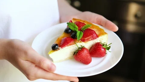 Cheesecake with berries on a plate. Stock Footage 282963108