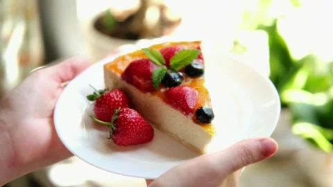 Cheesecake with berries on a plate. Stock Footage 282963111