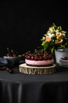 Cheesecake with cherries. Cherry cake on table Stock Photos