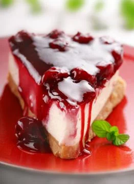Cheesecake with cherry sauce Stock Photos