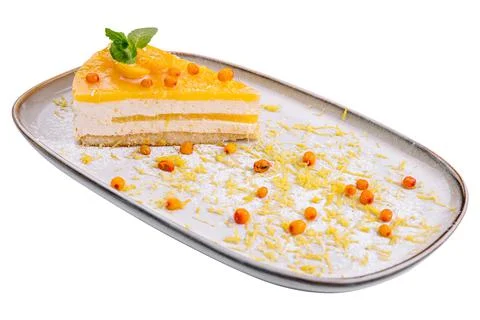 Cheesecake with orange chips on plate Stock Photos