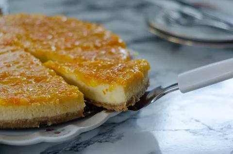 The cheesecake with orange. Stock Photos