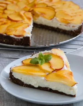 Cheesecake with peach Stock Photos