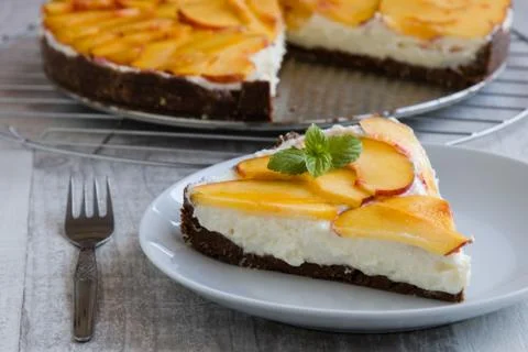 Cheesecake with peach Stock Photos