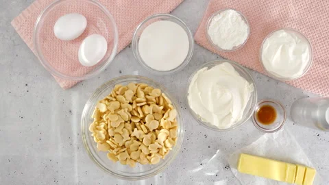Cheesecake recipe. Three mini round cake pans, and ingredients Stock Footage 258640951