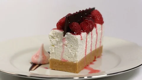 Cheesecake rotates on the turntable on a white background Stock Footage 84835122