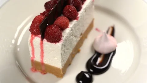 Cheesecake rotates on the turntable on a white background Stock Footage 84835647