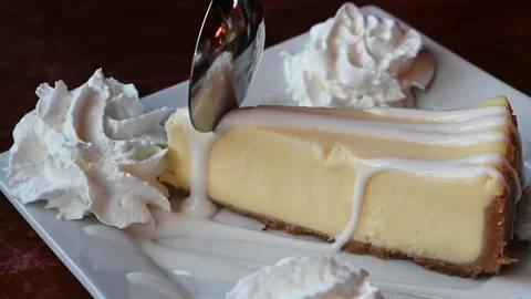 Cheesecake slice bite taken with spoon. Stock Footage 155070361