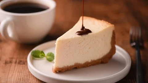 Cheesecake slice with chocolate sauce Stock Footage 102295187